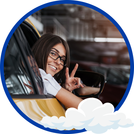 Happy driver waving from a freshly washed car